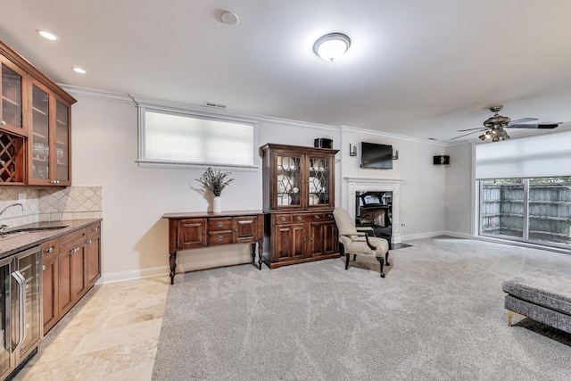 5021 N Kenmore Ave Unit 1S, Chicago, IL 60640 - living area with crown molding, wine cooler, ceiling fan, recessed lighting, and a fireplace with flush hearth