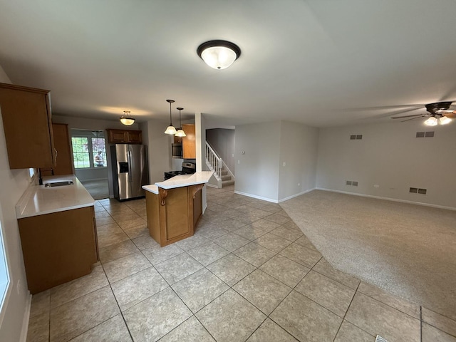 320 S Marguerite St, Coal City, IL 60416 - kitchen with appliances with stainless steel finishes, a sink, a peninsula, and light countertops