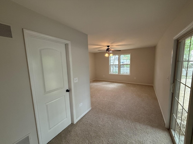 320 S Marguerite St, Coal City, IL 60416 - empty room with light colored carpet, healthy amount of natural light, baseboards, and ceiling fan