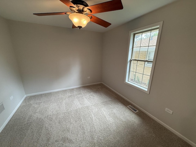 320 S Marguerite St, Coal City, IL 60416 - carpeted spare room featuring a ceiling fan and baseboards