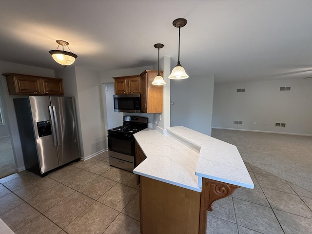 320 S Marguerite St, Coal City, IL 60416 - kitchen featuring stainless steel appliances, a peninsula, light tile patterned floors, hanging light fixtures, and baseboards
