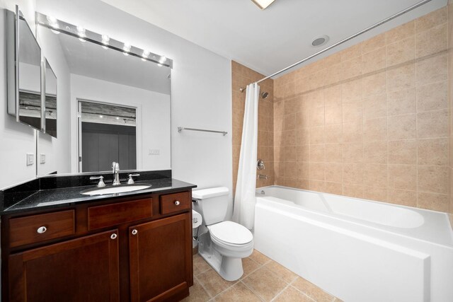 1150 W 15th St Unit 232, Chicago, IL 60608 - bathroom with toilet, shower / tub combo with curtain, vanity, and tile patterned flooring