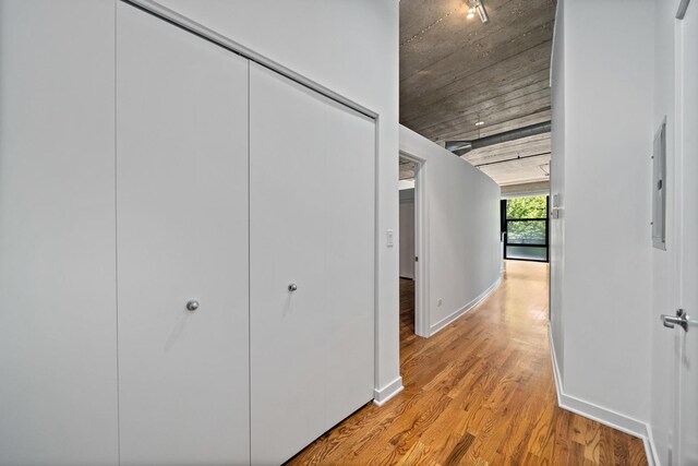 1150 W 15th St Unit 232, Chicago, IL 60608 - corridor with baseboards and light wood finished floors