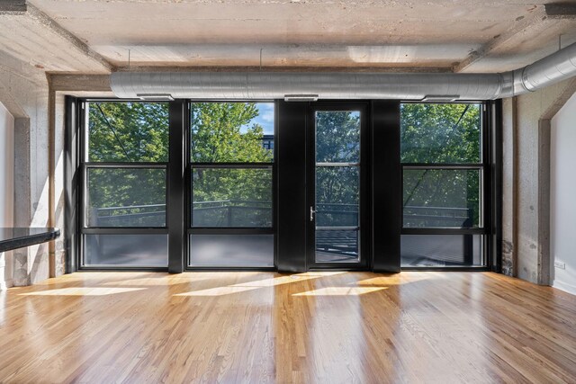 1150 W 15th St Unit 232, Chicago, IL 60608 - unfurnished room featuring wood finished floors