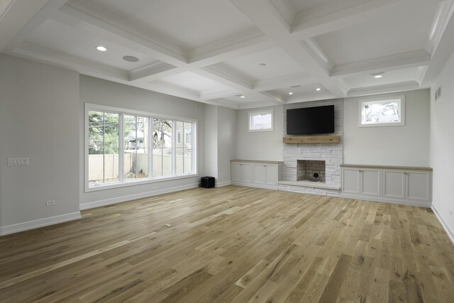 845 Tulip Ln, Naperville, IL 60540 - unfurnished living room with light wood-style floors, a fireplace, coffered ceiling, plenty of natural light, and beam ceiling
