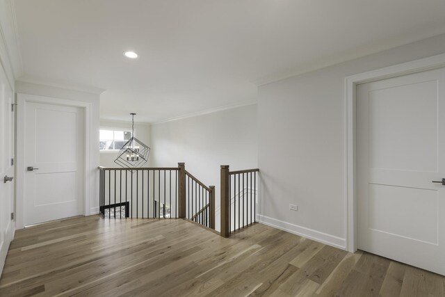 845 Tulip Ln, Naperville, IL 60540 - unfurnished room with a chandelier, ornamental molding, wood finished floors, recessed lighting, and baseboards