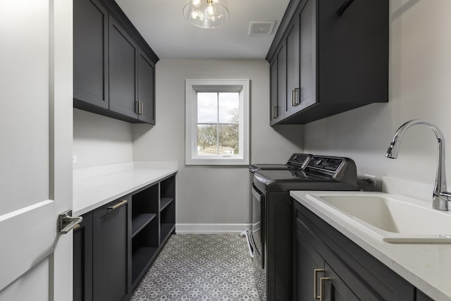845 Tulip Ln, Naperville, IL 60540 - washroom with cabinet space, washing machine and dryer, baseboards, and a chandelier