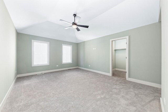 845 Tulip Ln, Naperville, IL 60540 - unfurnished bedroom with lofted ceiling, carpet flooring, and baseboards