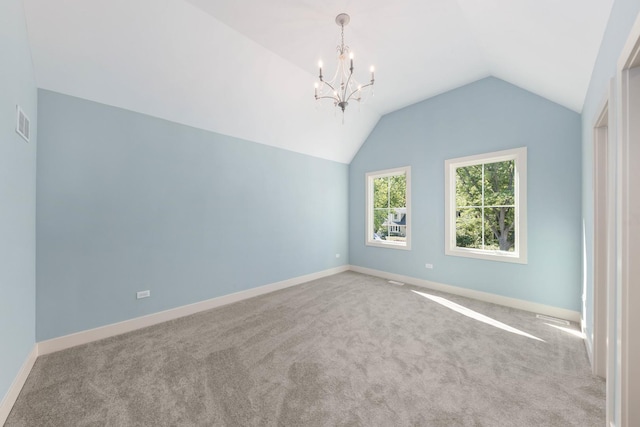 845 Tulip Ln, Naperville, IL 60540 - carpeted spare room featuring lofted ceiling, a chandelier, and baseboards