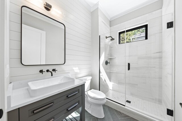 845 Tulip Ln, Naperville, IL 60540 - bathroom featuring crown molding, a shower stall, toilet, vanity, and wooden walls