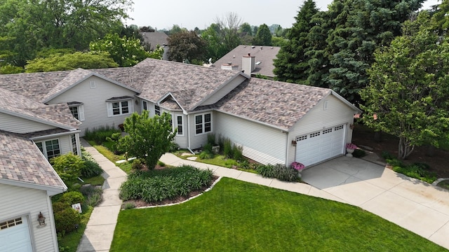 873 Beauchamp Ave, Manteno, IL 60950 - view of front of house with a front lawn and a garage
