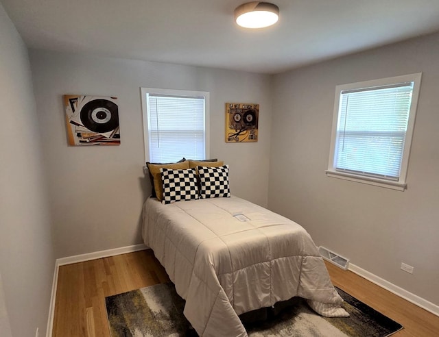 7447 Beloit Ave, Bridgeview, IL 60455 - bedroom with multiple windows and wood finished floors