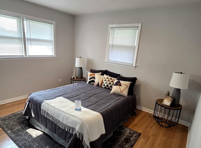 7447 Beloit Ave, Bridgeview, IL 60455 - bedroom featuring light wood finished floors and multiple windows