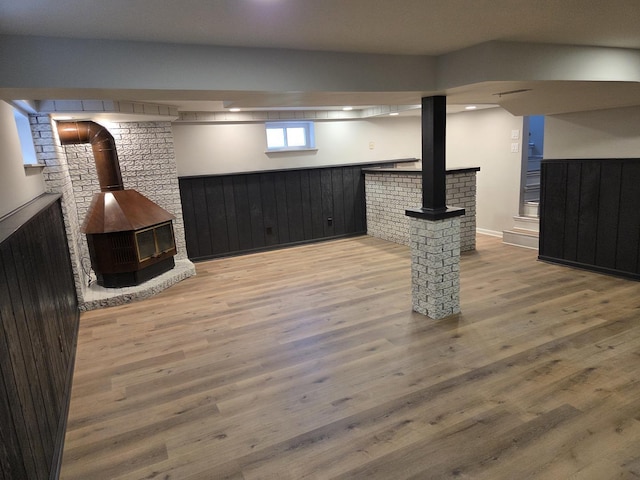 7447 Beloit Ave, Bridgeview, IL 60455 - basement with a wood stove and wood finished floors