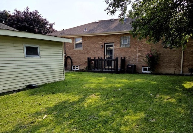 7447 Beloit Ave, Bridgeview, IL 60455 - rear view of property featuring a yard, brick siding, and roof with shingles