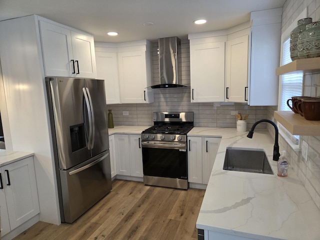 7447 Beloit Ave, Bridgeview, IL 60455 - kitchen with stainless steel appliances, wall chimney exhaust hood, light stone counters, tasteful backsplash, and recessed lighting