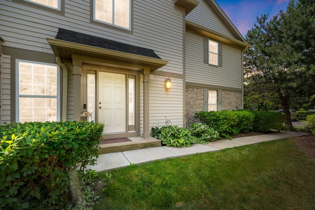 2119 Ivy Ridge Dr Unit 2119, Hoffman Estates, IL 60192 - entrance to property featuring a shingled roof and brick siding