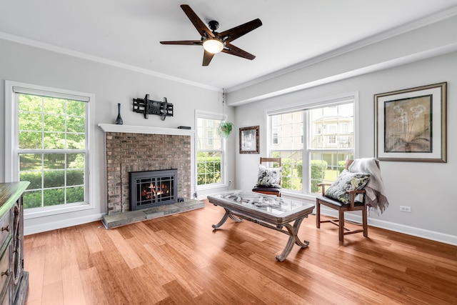 2119 Ivy Ridge Dr Unit 2119, Hoffman Estates, IL 60192 - living area featuring ornamental molding, a ceiling fan, a fireplace, and wood finished floors
