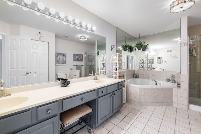 2119 Ivy Ridge Dr Unit 2119, Hoffman Estates, IL 60192 - full bathroom featuring tile patterned floors, a shower stall, double vanity, and a garden tub