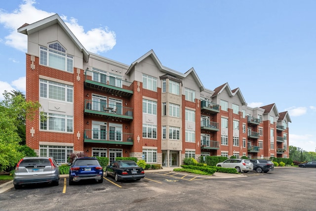 620 Mchenry Rd Unit 102, Wheeling, IL 60090 - view of building exterior with uncovered parking