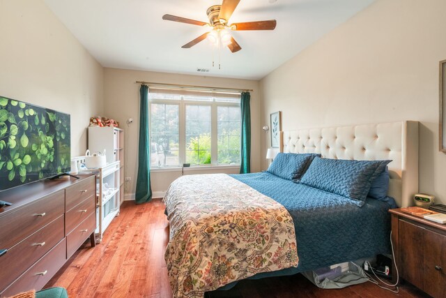 620 Mchenry Rd Unit 102, Wheeling, IL 60090 - bedroom with light wood-style floors and a ceiling fan
