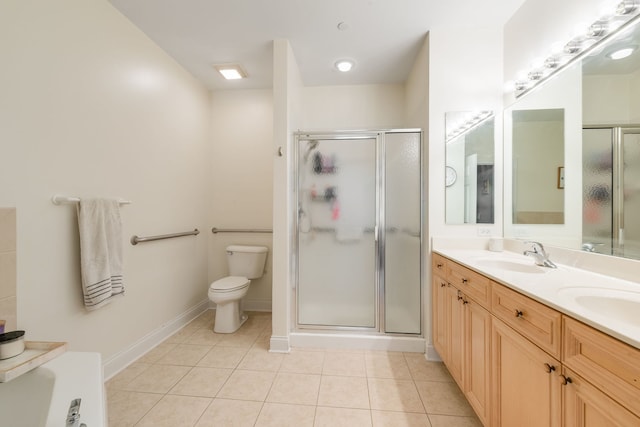 620 Mchenry Rd Unit 102, Wheeling, IL 60090 - bathroom with double vanity, a stall shower, and tile patterned flooring