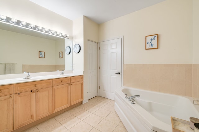 620 Mchenry Rd Unit 102, Wheeling, IL 60090 - bathroom featuring tile patterned flooring, a garden tub, and double vanity