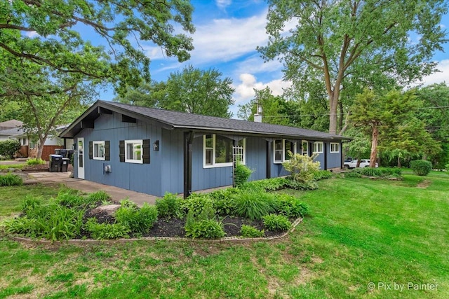 1912 Oakleaf Dr, Mchenry, IL 60050 - view of front facade featuring a front yard and a chimney