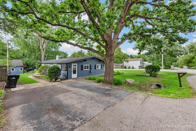 1912 Oakleaf Dr, Mchenry, IL 60050 - ranch-style home with a front lawn and a chimney