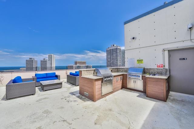 2754 N Hampden Ct Unit 2002, Chicago, IL 60614 - view of patio featuring an outdoor hangout area, area for grilling, and a city view