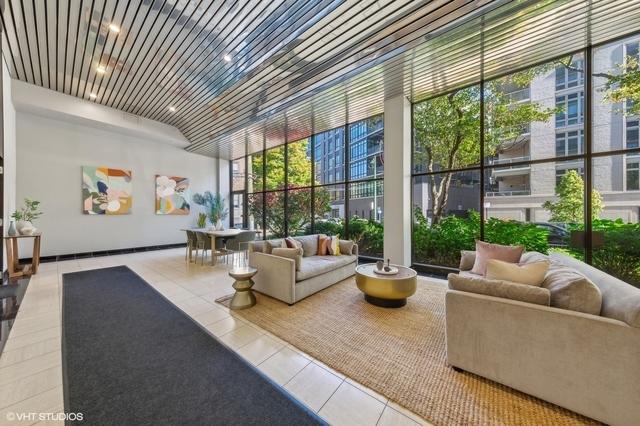2754 N Hampden Ct Unit 2002, Chicago, IL 60614 - community lobby featuring a wall of windows and a towering ceiling