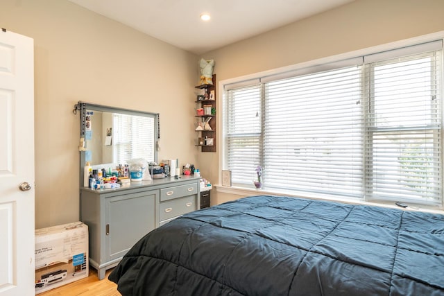 4848 W Belle Plaine Ave Unit 2R, Chicago, IL 60641 - bedroom with multiple windows, light wood-style flooring, and recessed lighting