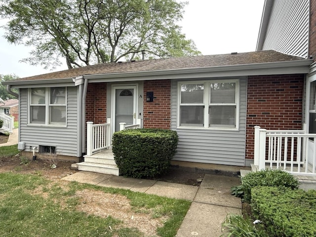 view of front of home with brick siding