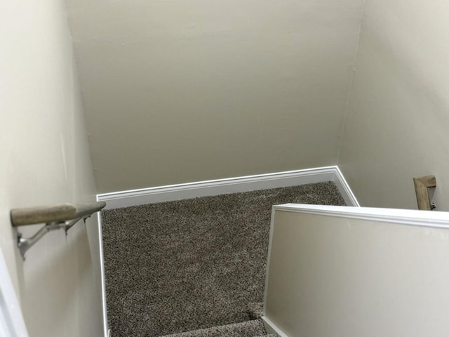 stairs with baseboards