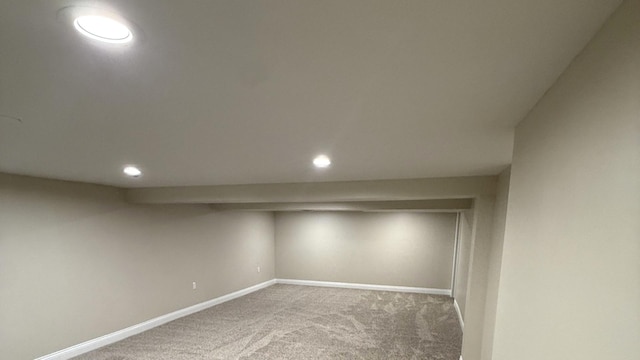 finished below grade area with carpet flooring and recessed lighting