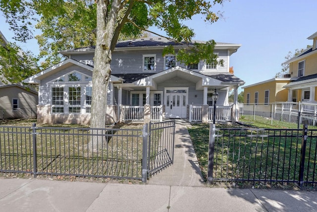 504 E Church St, Champaign, IL 61820 - view of front of house featuring covered porch, a fenced front yard, a gate, and roof with shingles