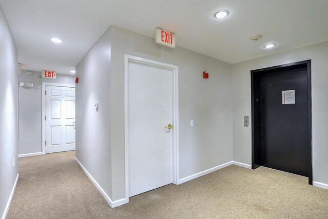504 E Church St, Champaign, IL 61820 - hallway featuring carpet floors, baseboards, and recessed lighting