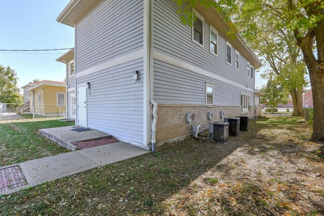 504 E Church St, Champaign, IL 61820 - view of home's exterior with brick siding and cooling unit