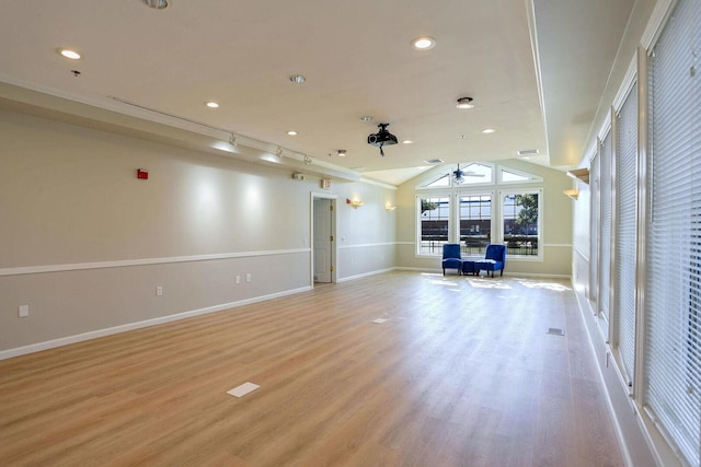 504 E Church St, Champaign, IL 61820 - unfurnished living room featuring ceiling fan, light wood-style flooring, baseboards, vaulted ceiling, and recessed lighting