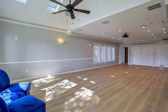 504 E Church St, Champaign, IL 61820 - unfurnished living room featuring ceiling fan, ornamental molding, baseboards, light wood-style floors, and recessed lighting