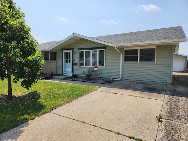 49 Ambassador Dr, Romeoville, IL 60446 - view of front of home featuring a front yard and a shingled roof