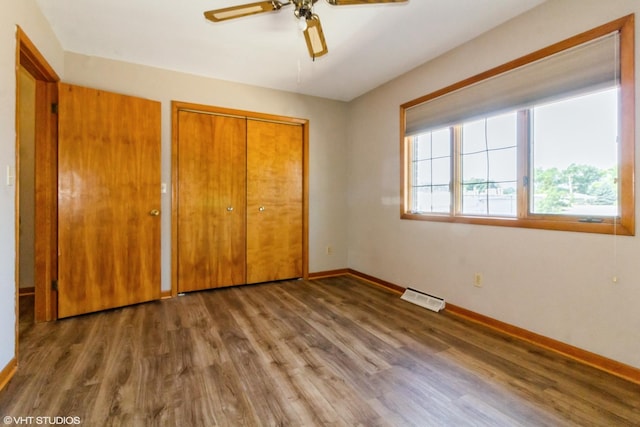 613 E 3rd St Unit 4, Lockport, IL 60441 - unfurnished bedroom featuring wood finished floors, a closet, and ceiling fan