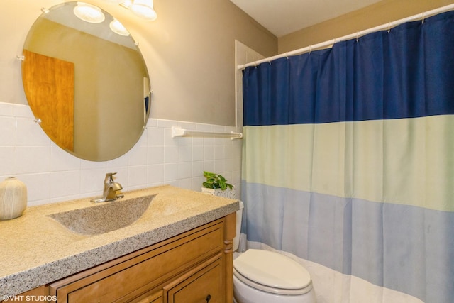 613 E 3rd St Unit 4, Lockport, IL 60441 - bathroom with vanity, a shower with curtain, and a wainscoted wall