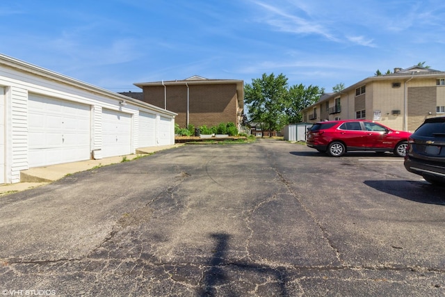 613 E 3rd St Unit 4, Lockport, IL 60441 - view of parking featuring community garages