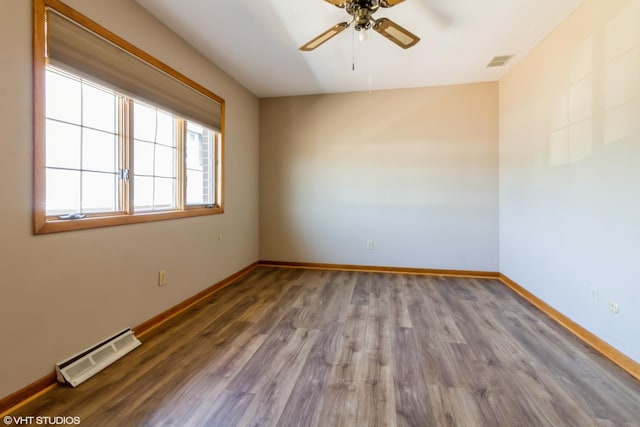 613 E 3rd St Unit 4, Lockport, IL 60441 - spare room featuring a ceiling fan and wood finished floors