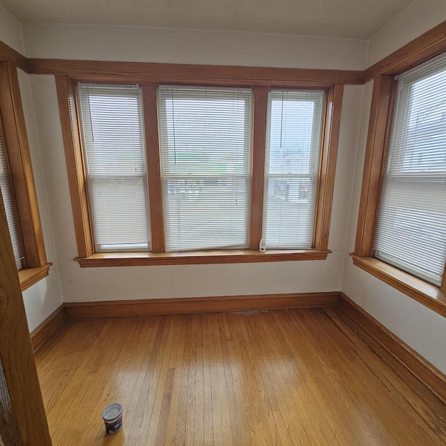 3054 N Kedzie Ave Unit 1F, Chicago, IL 60618 - unfurnished room featuring light wood-style floors and baseboards
