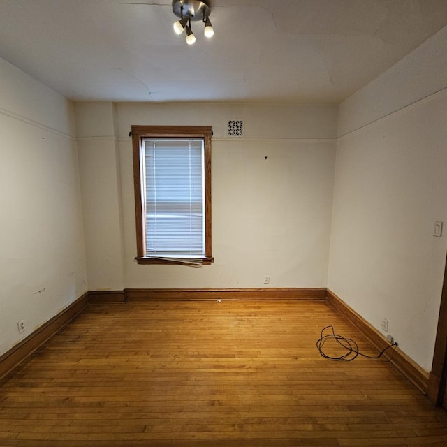 3054 N Kedzie Ave Unit 1F, Chicago, IL 60618 - unfurnished room featuring hardwood / wood-style flooring and baseboards