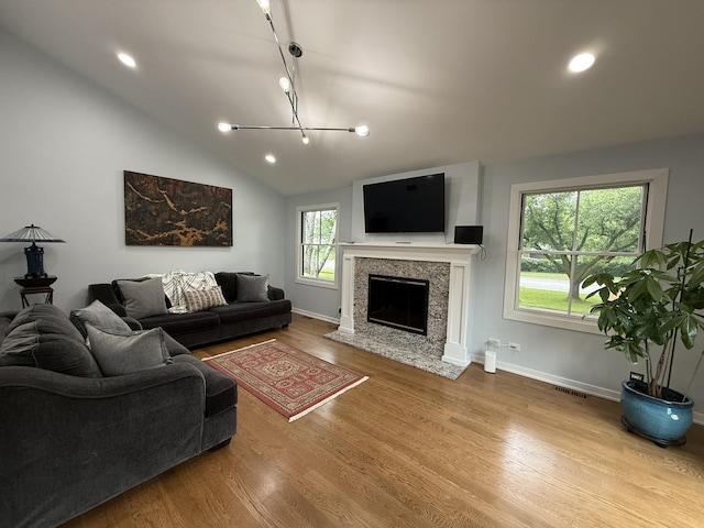 1303 Jane Ave, Naperville, IL 60540 - living area featuring wood finished floors, a high end fireplace, recessed lighting, and vaulted ceiling