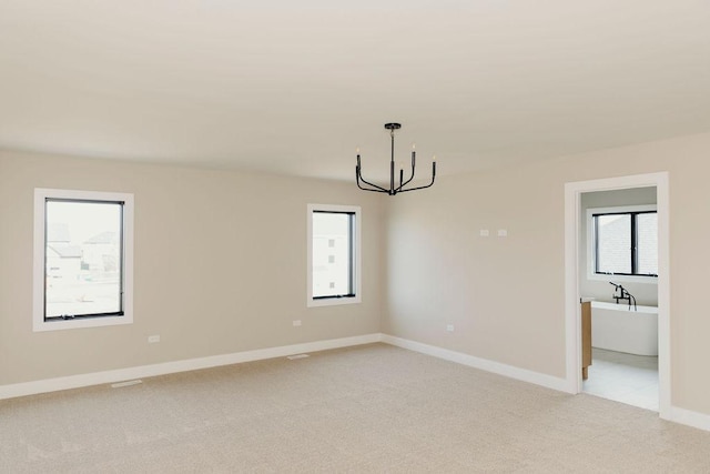 20277 Brendan St, Frankfort, IL 60423 - spare room with a chandelier, light carpet, and baseboards