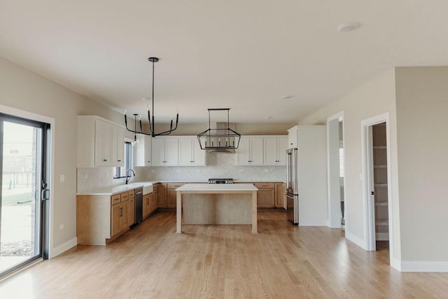 20277 Brendan St, Frankfort, IL 60423 - kitchen with stainless steel appliances, decorative backsplash, light wood finished floors, and light countertops